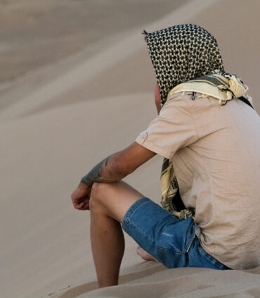 man on sand dune